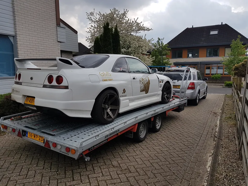 White Nissan Skyline R33 on a trailer