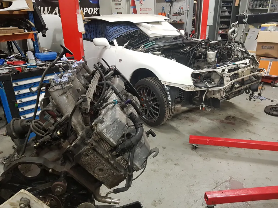 Engine and project car in the workshop