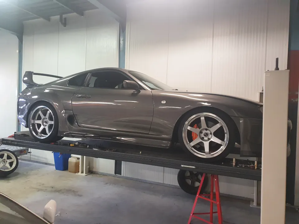 Grey Nissan Silvia on a vehicle lift