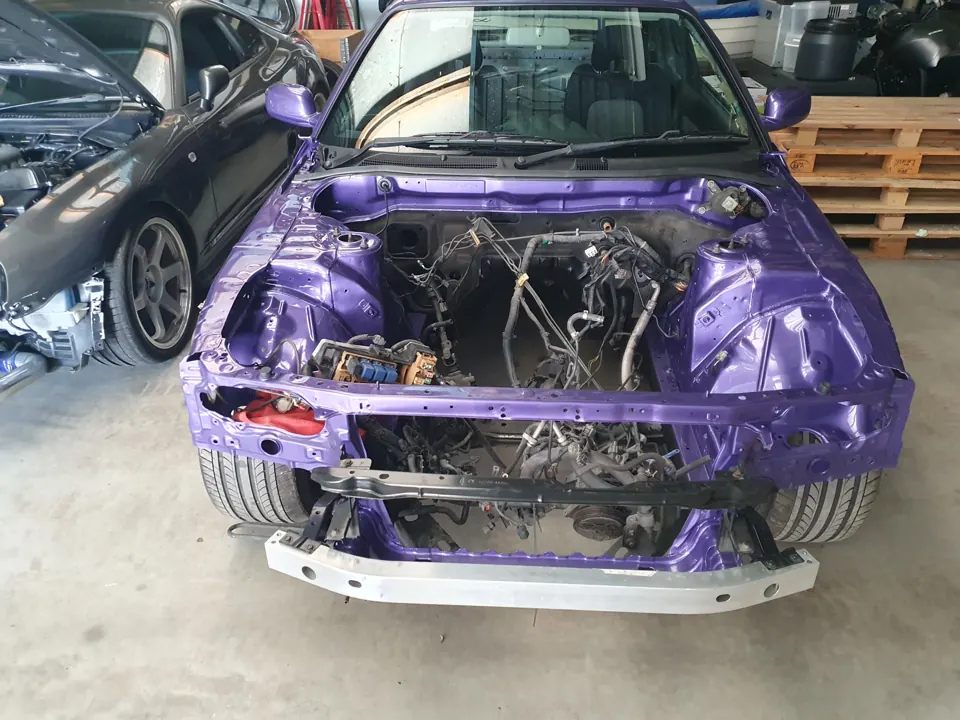 Purple project car with its front panels removed