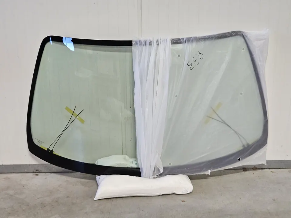 Car windscreen in protective packaging