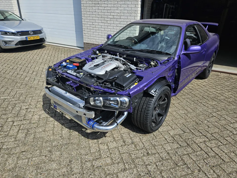 Purple project car with exposed engine bay