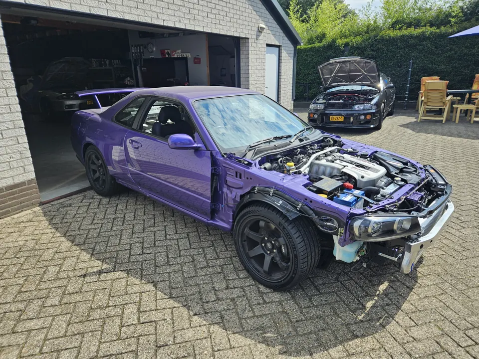 Body panel installation on a purple project car