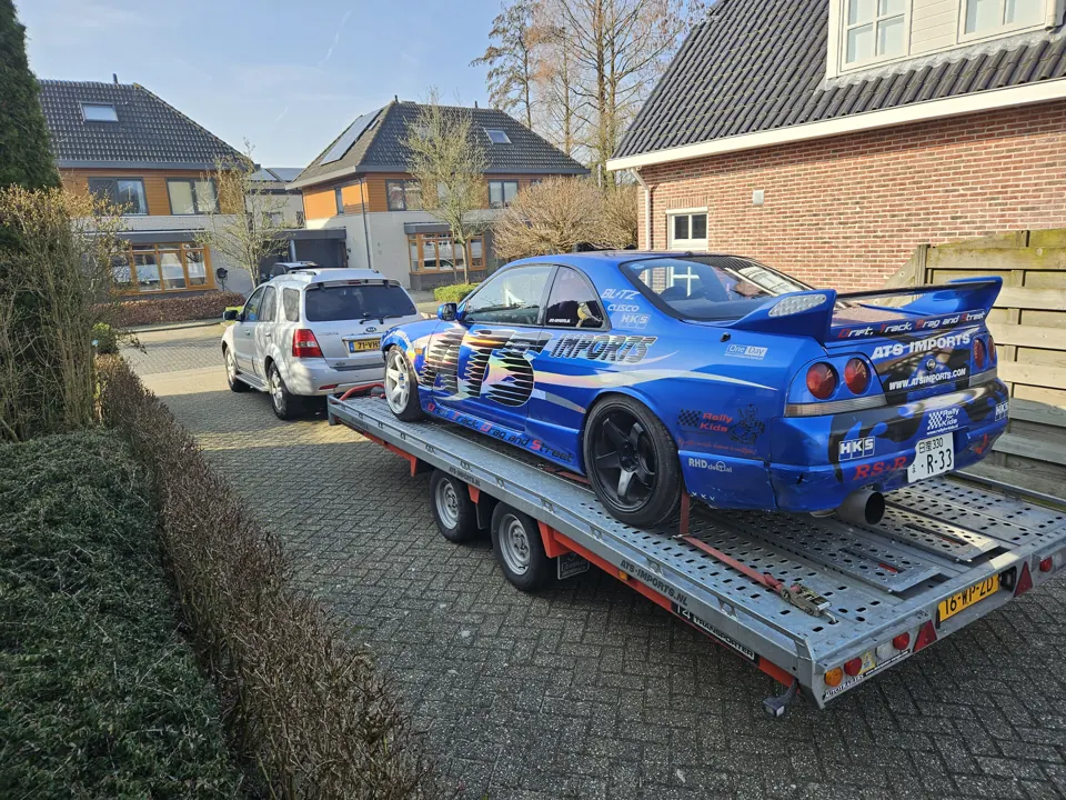 Blue ATS drift car on a trailer