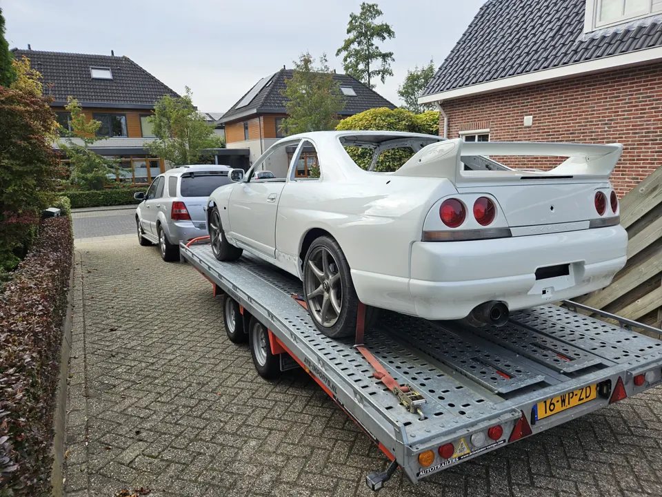 White Nissan Skyline R34 on a trailer